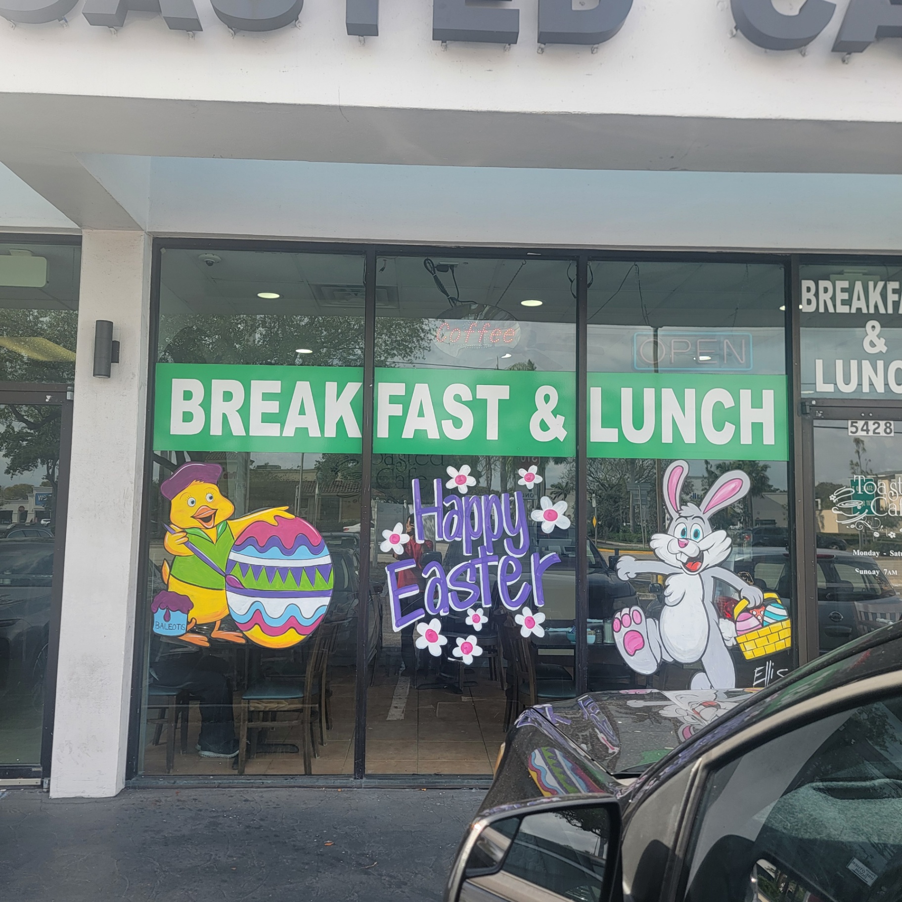Toasted Cafe storefront with Happy Easter window art