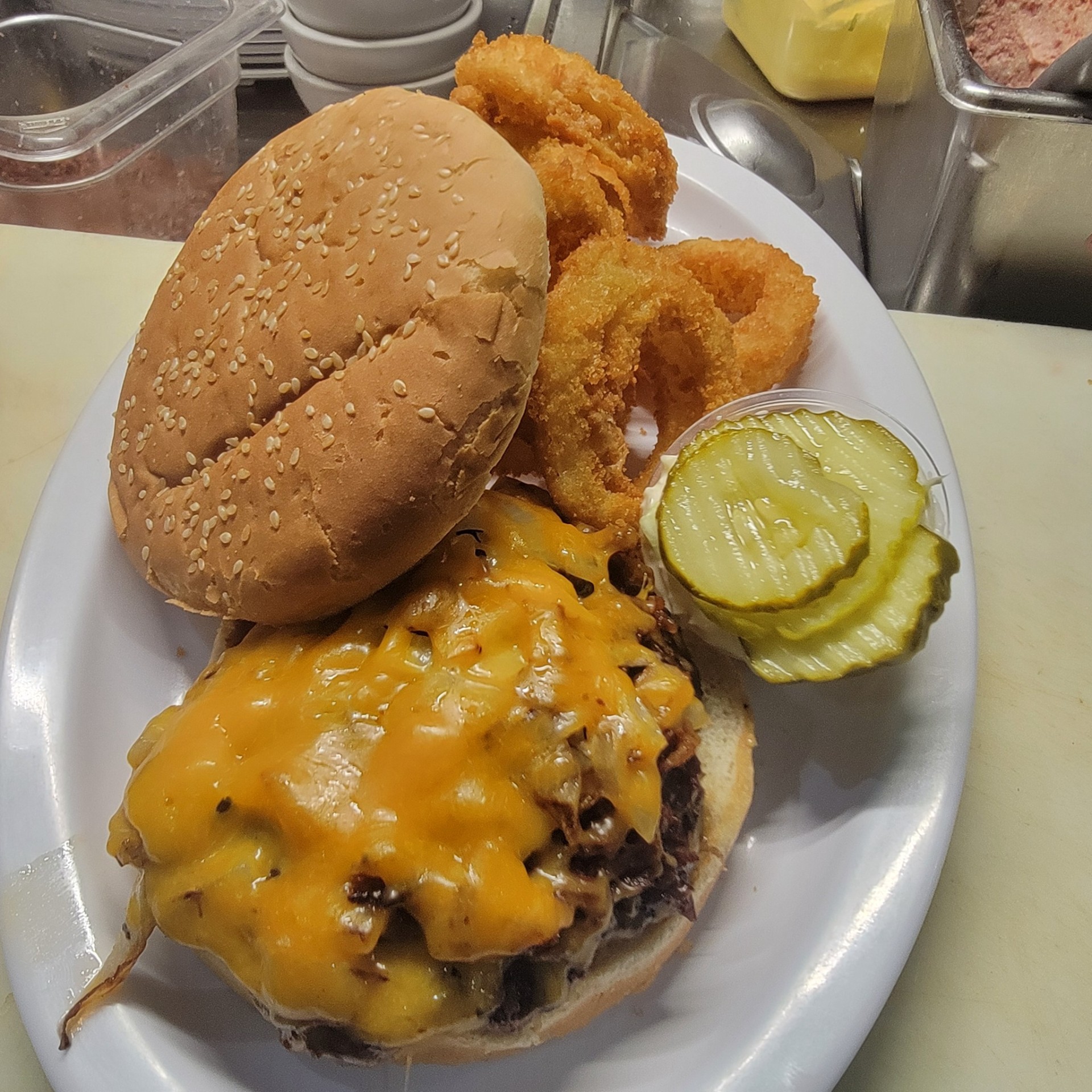Toasted Signature Burger with onion rings