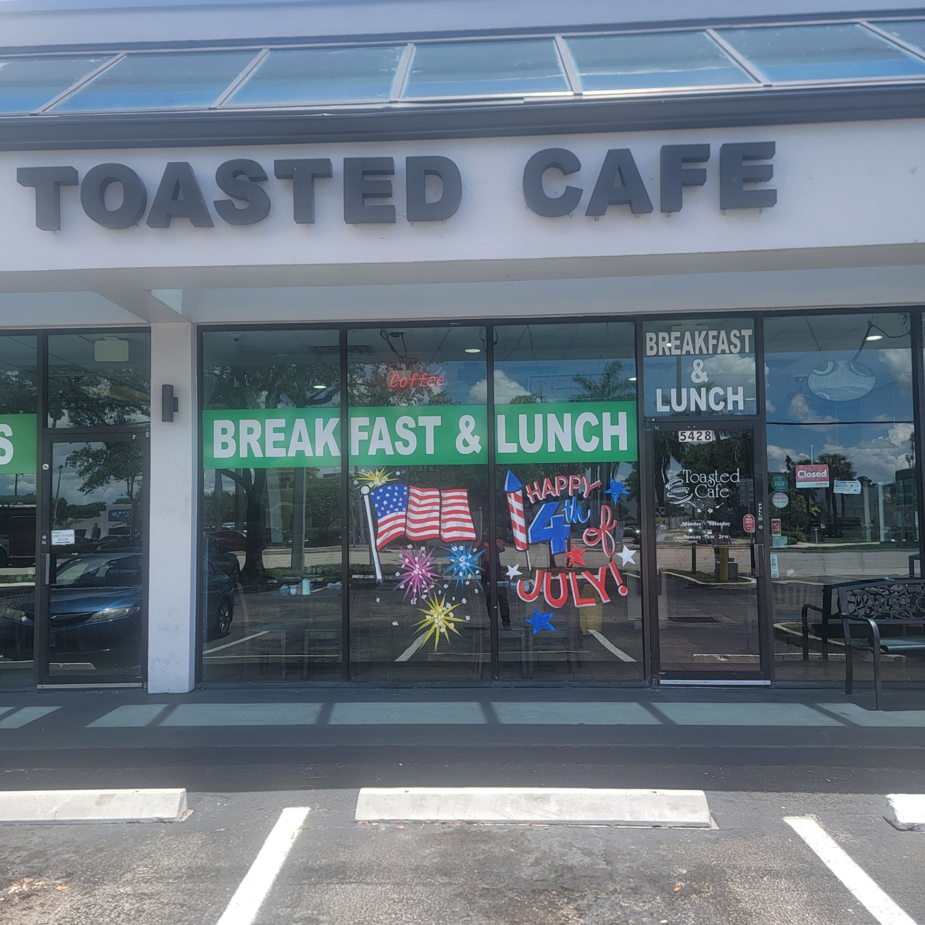 Toasted Cafe storefront decorated for the 4th of July