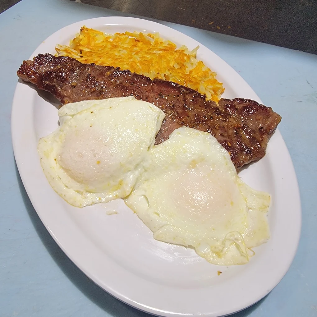 Steak & Eggs at Toasted Cafe — Seared steak, two eggs any style and golden hash browns — a proper hearty breakfast.